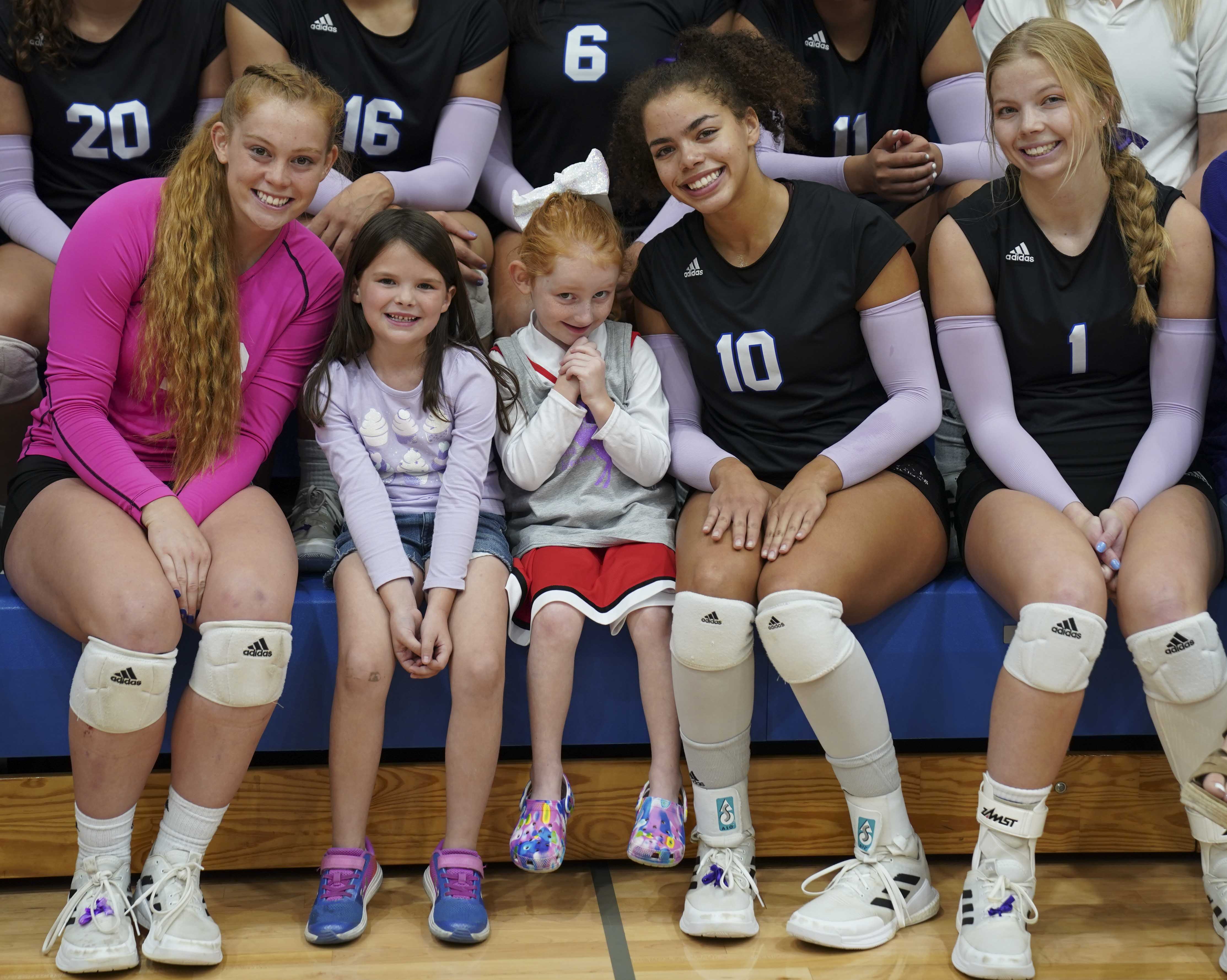 Stella McConnell (center) with MCC volleyball players