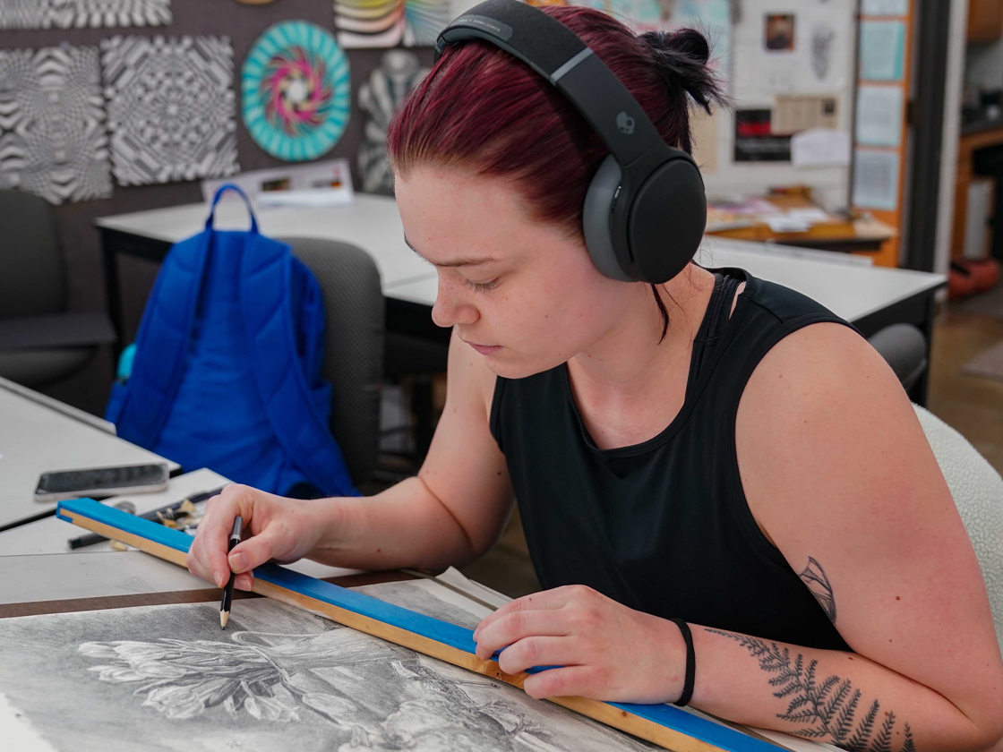 Miriam Wahlqvist works on her artwork in the Wrightstone Gallery.
