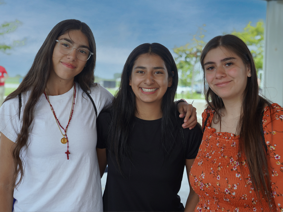 Three Students Smiling